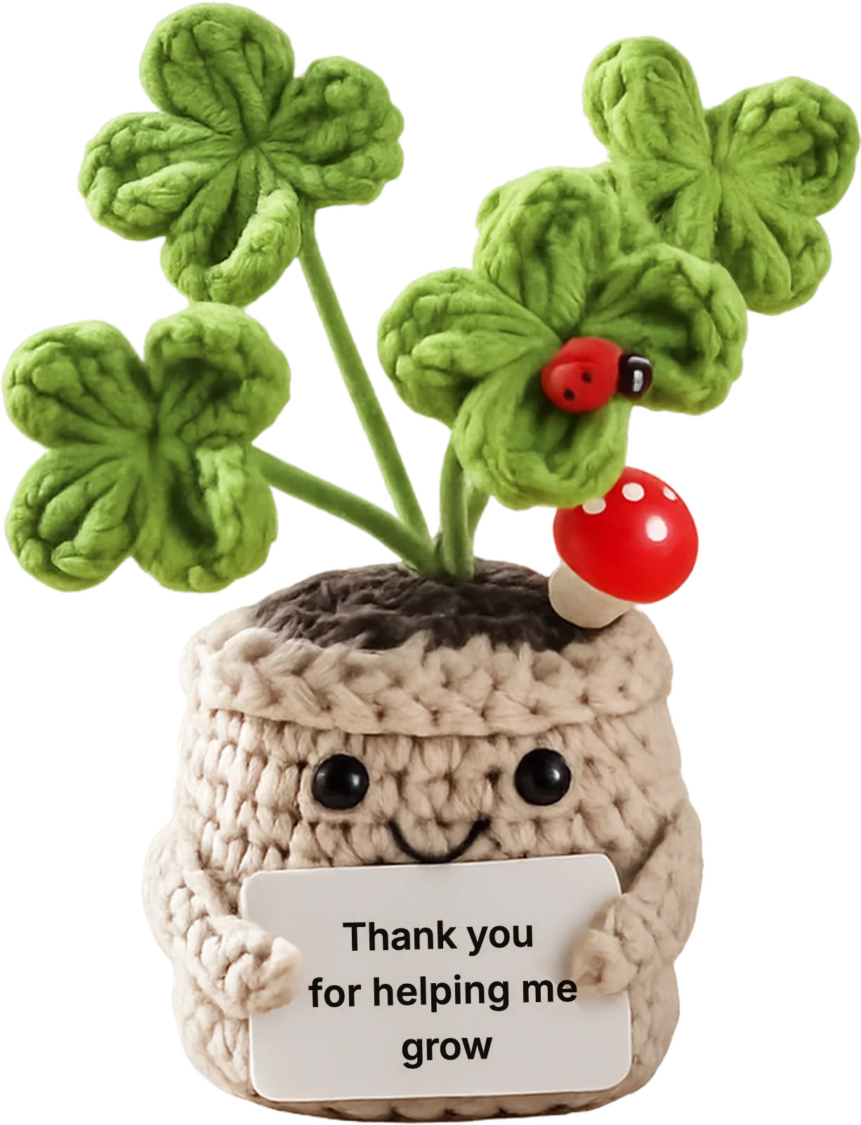 Quadbert, our crochet mascot with four four-leaf clovers growing from his head, holding a sign that reads: Thank you for helping me grow.